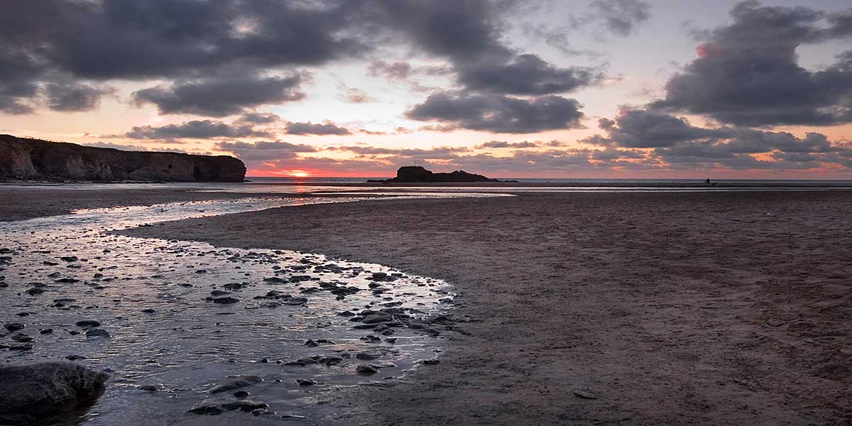 Golden sunset over Perran Beach, viewed from No.10 Sand Bay